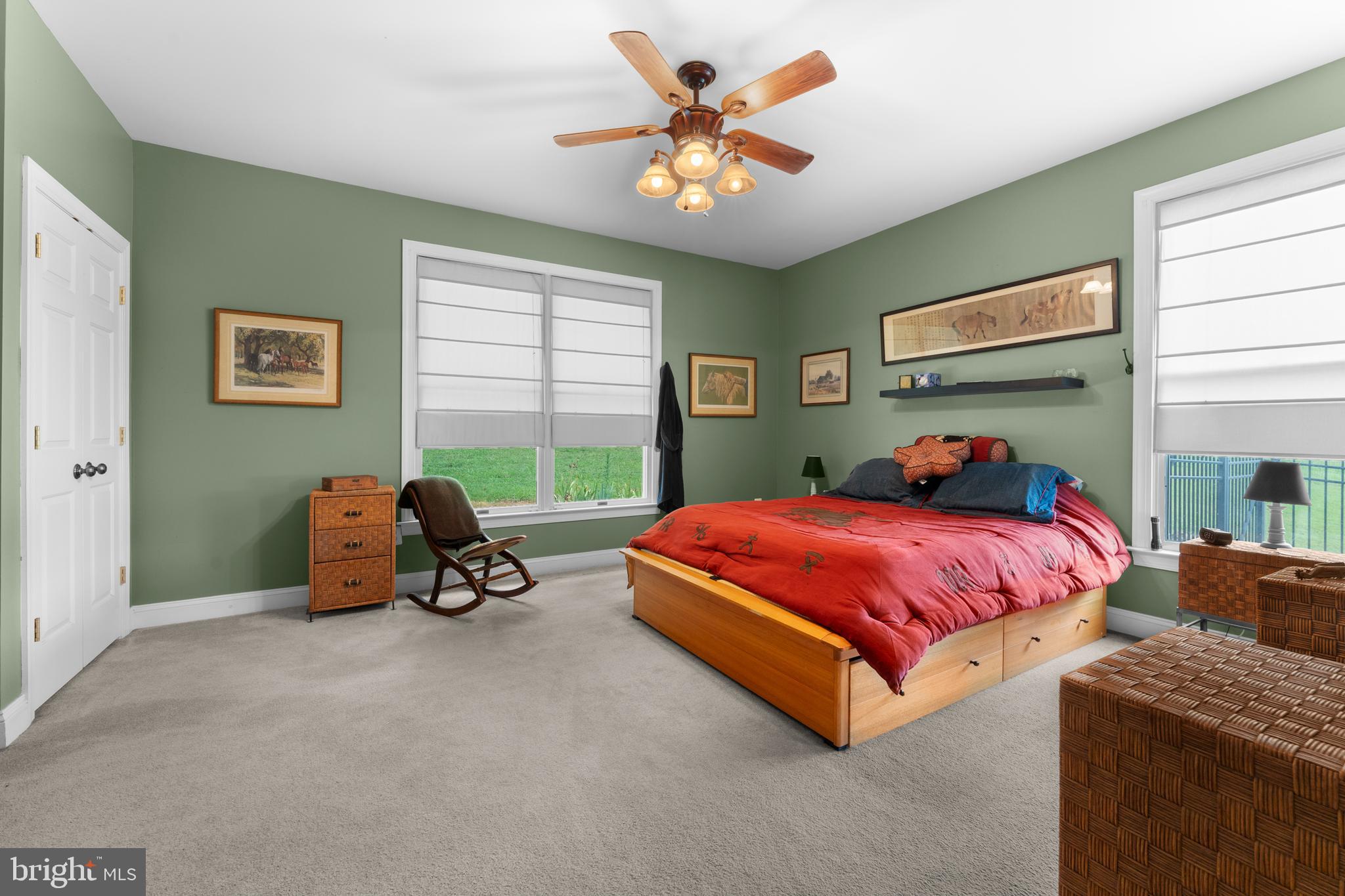 8260 River Hills Lane Rixeyville, VA 22737 - Photo 24 of 104 a bedroom with a bed and a chandelier