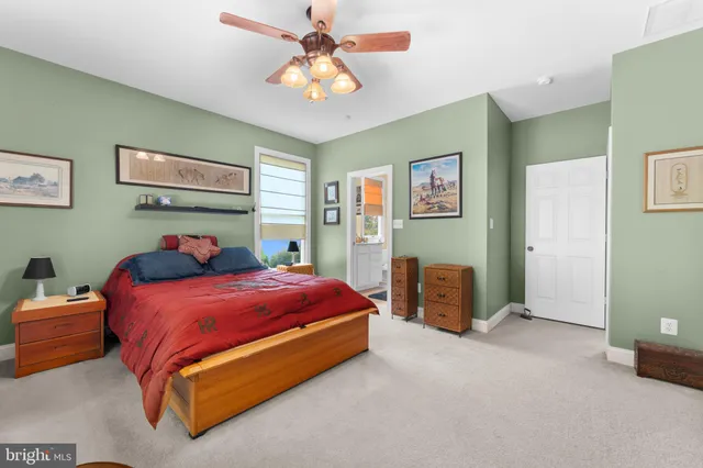 a kitchen with stainless steel appliances a sink cabinets and a window