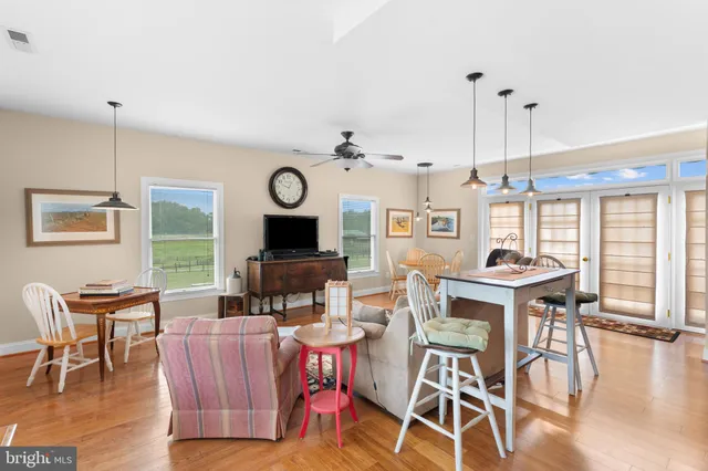 a bathroom with a sink a vanity and a large mirror