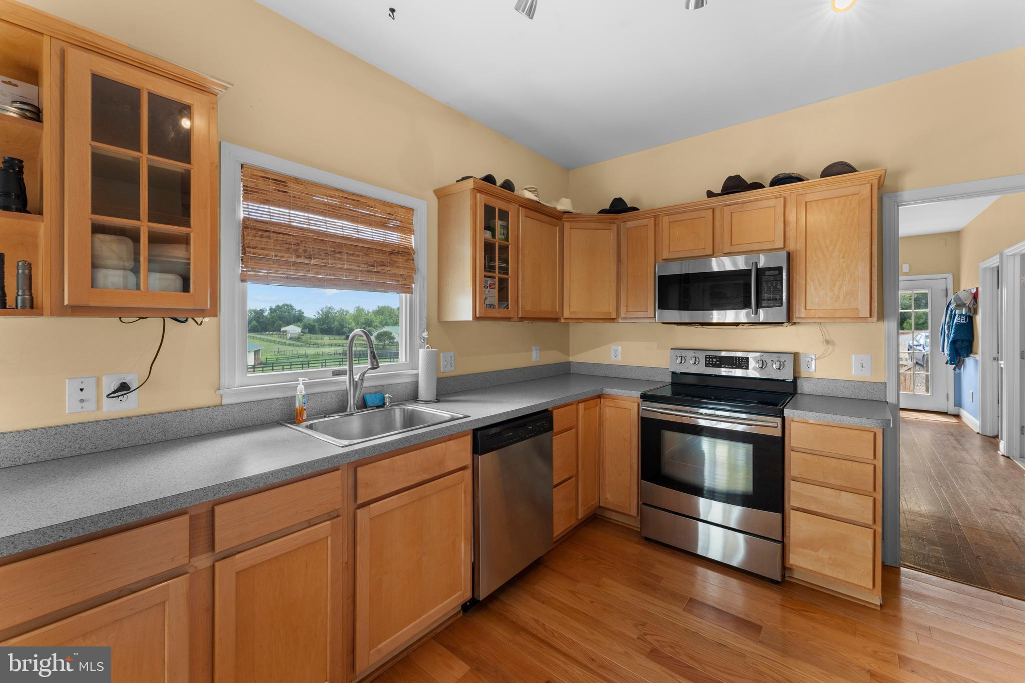 8260 River Hills Lane Rixeyville, VA 22737 - Photo 48 of 104 a kitchen with stainless steel appliances a sink cabinets and a window
