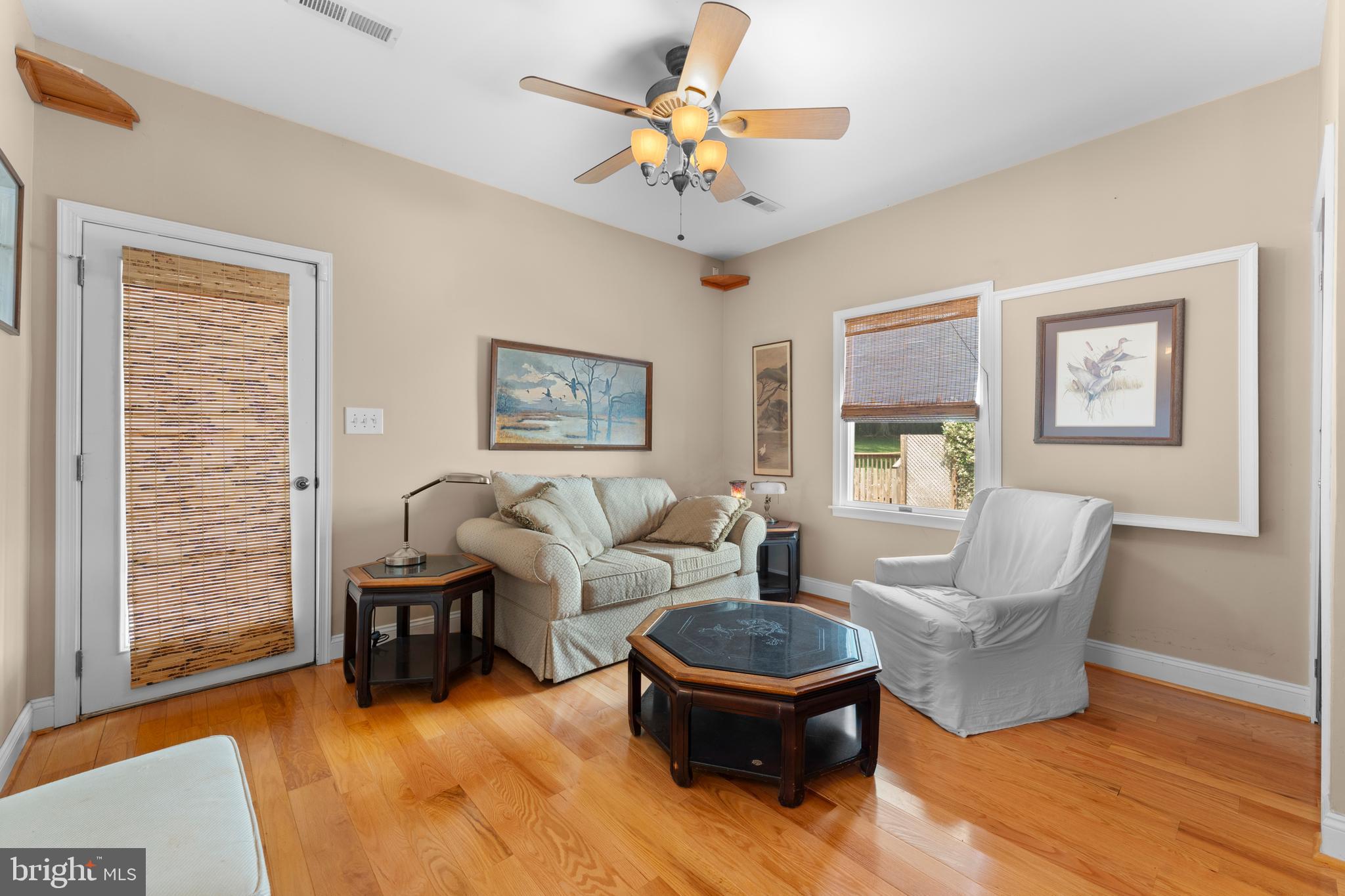 8260 River Hills Lane Rixeyville, VA 22737 - Photo 53 of 104 a living room with furniture and a chandelier