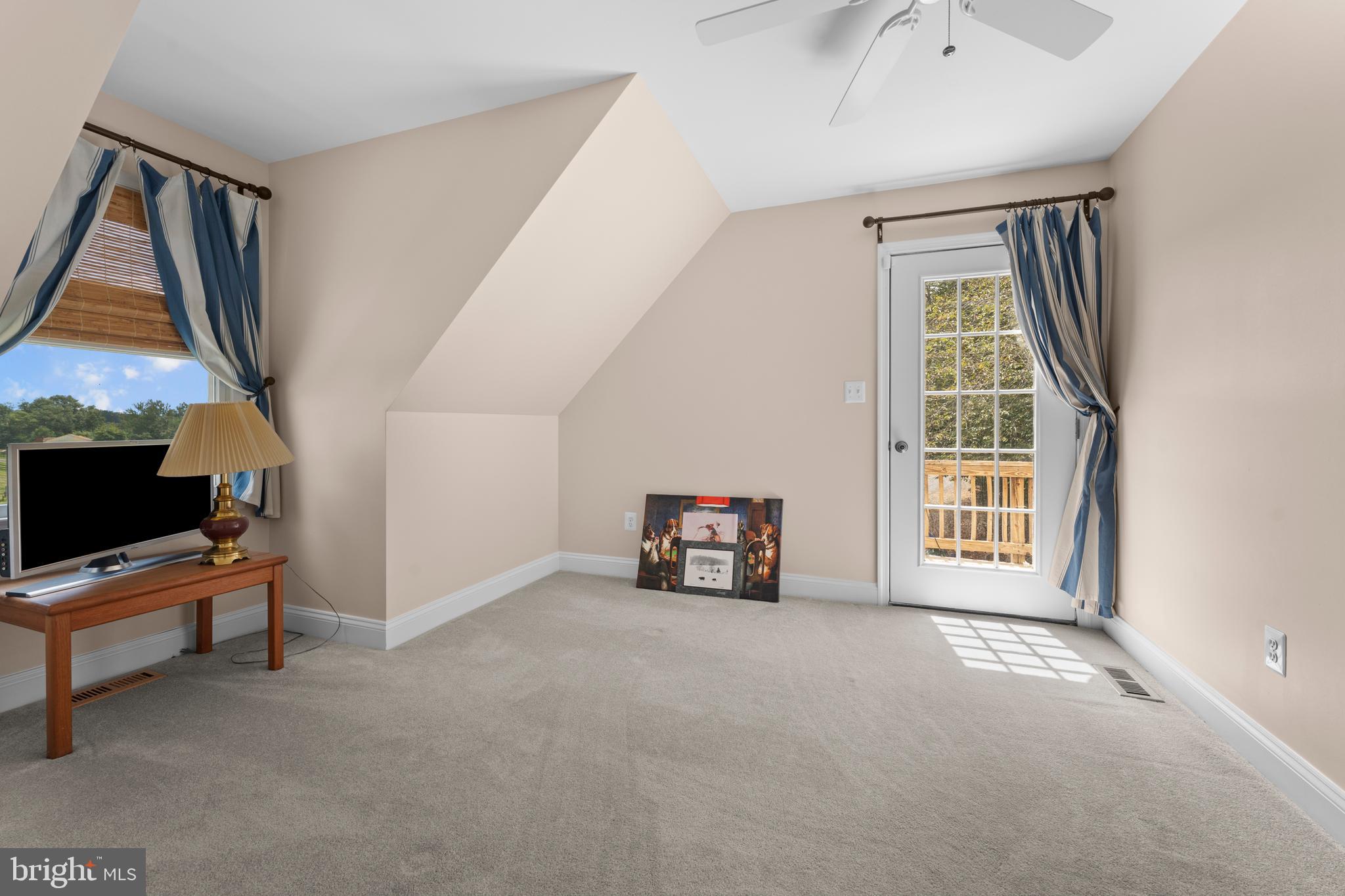 8260 River Hills Lane Rixeyville, VA 22737 - Photo 63 of 104 a view of an empty room with furniture and a window