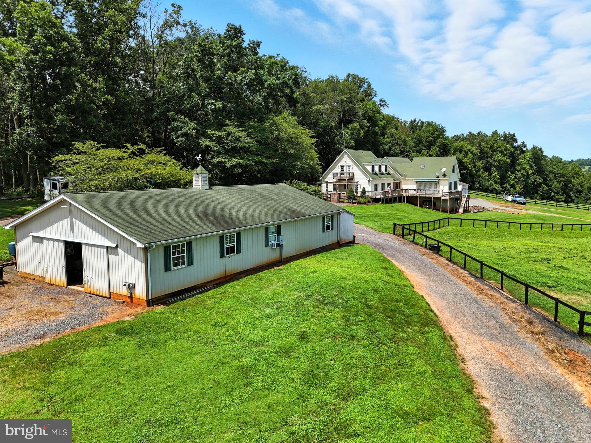 8260 River Hills Lane Rixeyville, VA 22737 - Photo 78 of 104 a aerial view of a house in front of a big yard with large trees