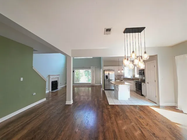 a view of a living room and dining room