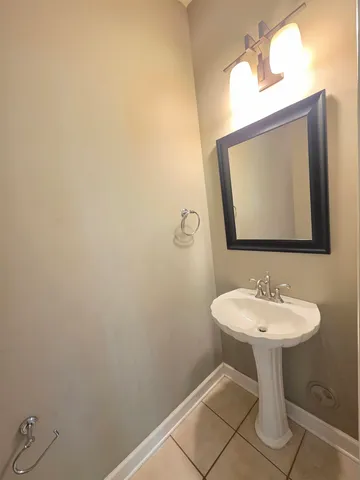 a bathroom with a sink a mirror and a toilet