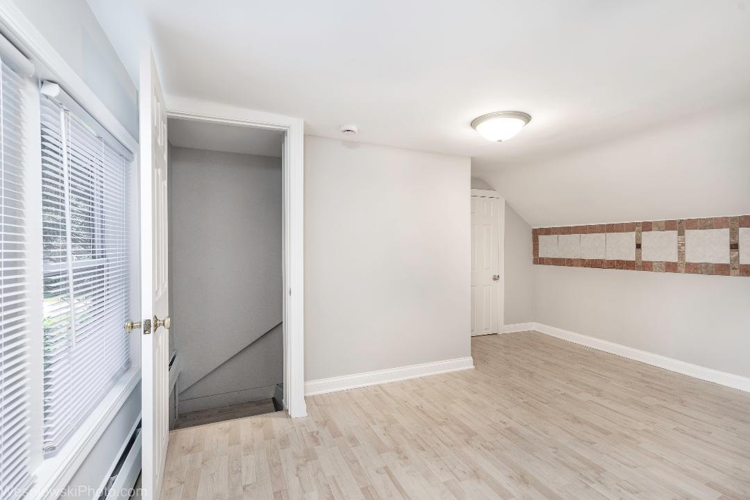 7700 Garden Lane Justice, IL 60458 - Photo 11 of 17 a view of an empty room with wooden floor and a window