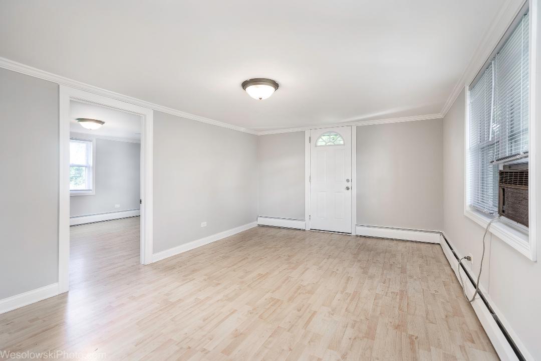 7700 Garden Lane Justice, IL 60458 - Photo 12 of 17 wooden floor in an empty room with a window