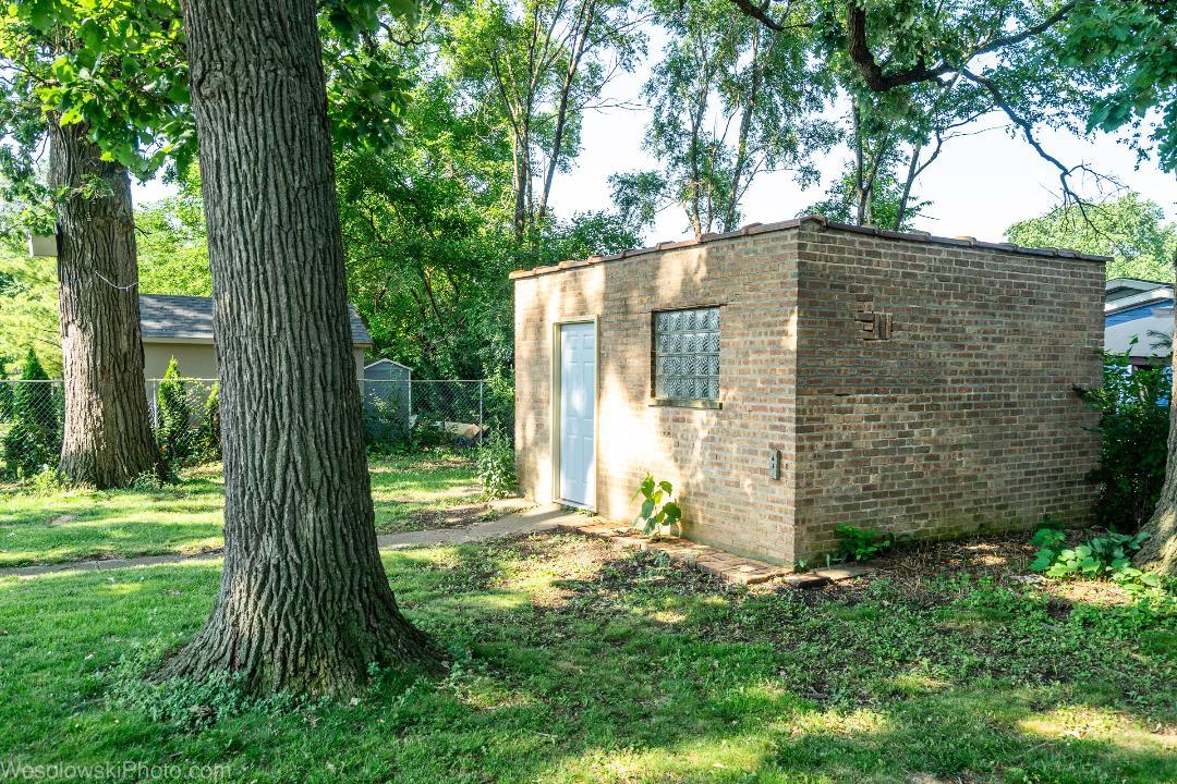 7700 Garden Lane Justice, IL 60458 - Photo 17 of 17 a view of a back yard with a trees