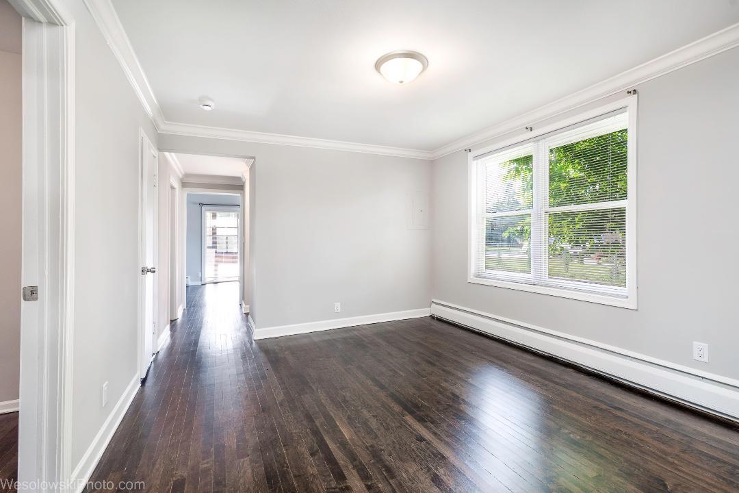 7700 Garden Lane Justice, IL 60458 - Photo 10 of 17 wooden floor in an empty room with a window