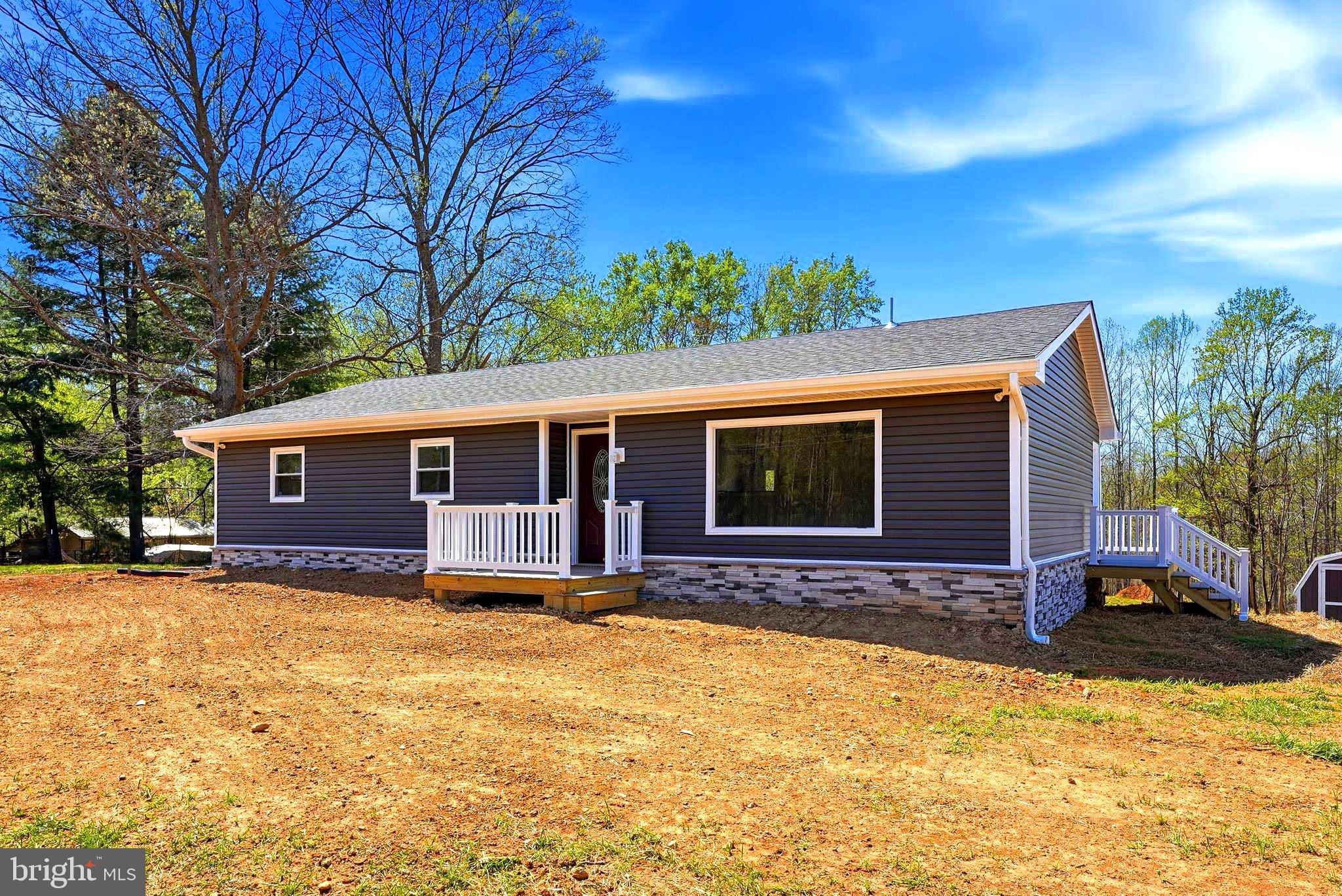 a view of house with yard and outdoor space