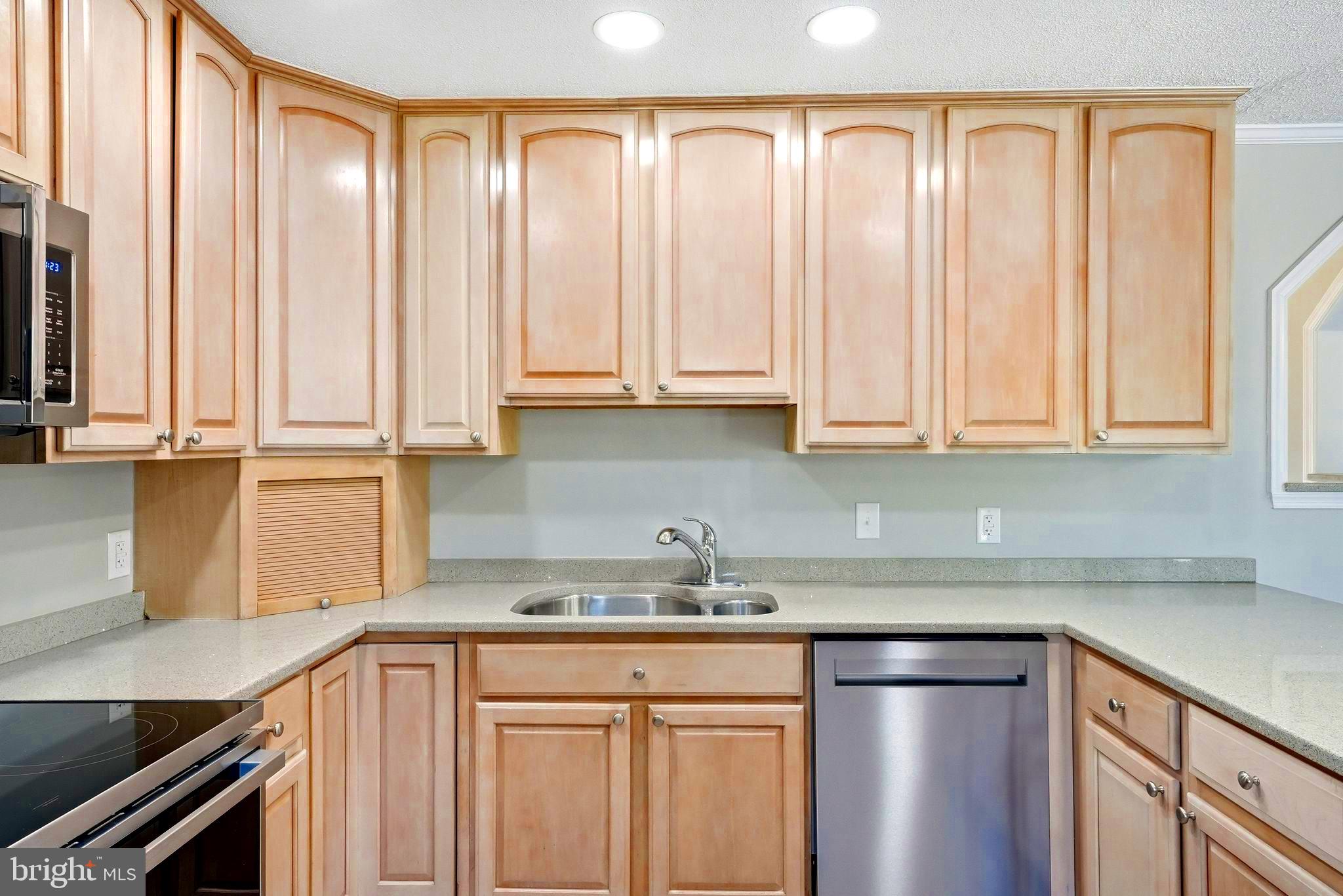 22064 Yellow Bottom Road Lignum, VA 22726 - Photo 17 of 50 a kitchen with stainless steel appliances granite countertop a sink a refrigerator and cabinets