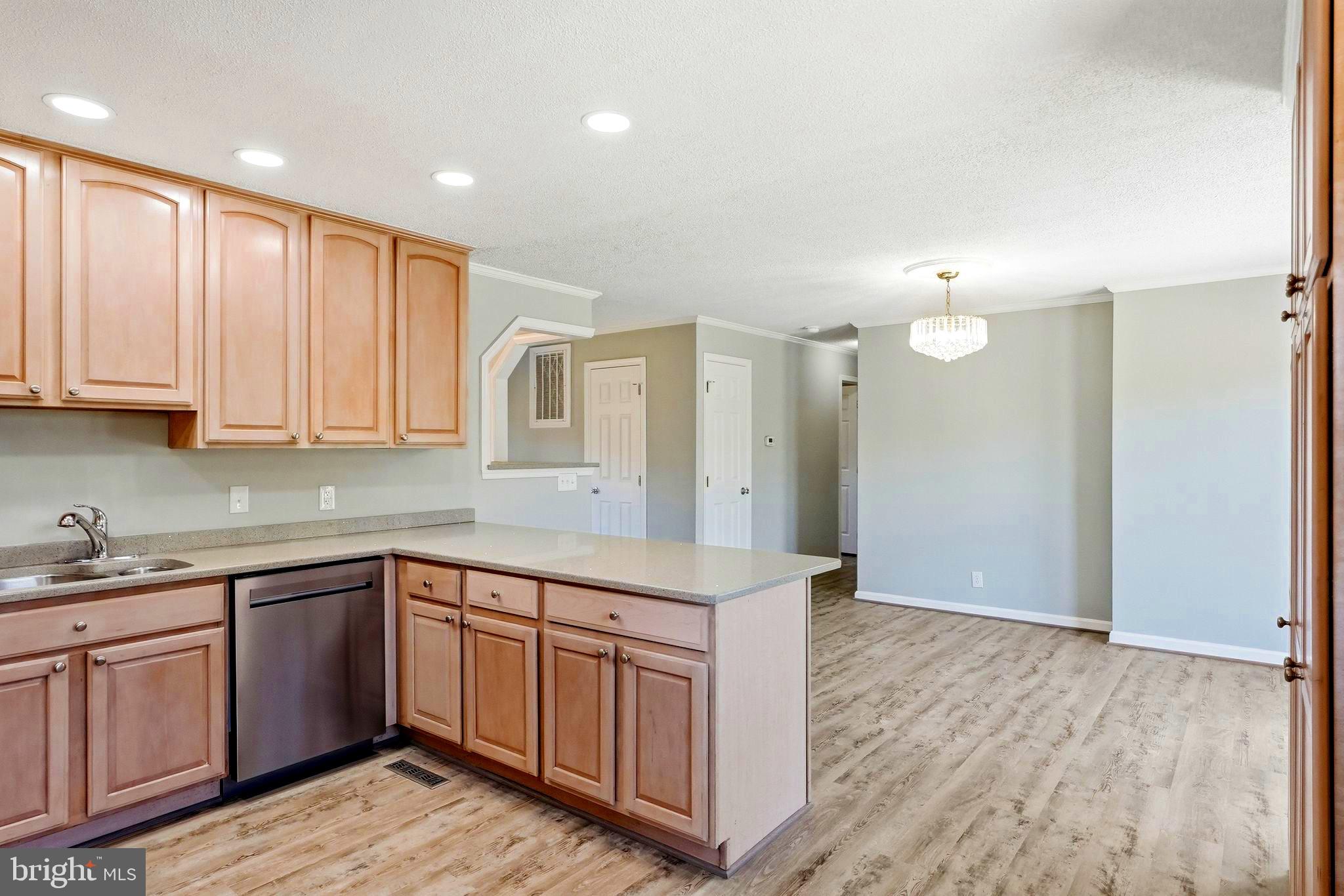 22064 Yellow Bottom Road Lignum, VA 22726 - Photo 18 of 50 a kitchen with a sink cabinets and wooden floor