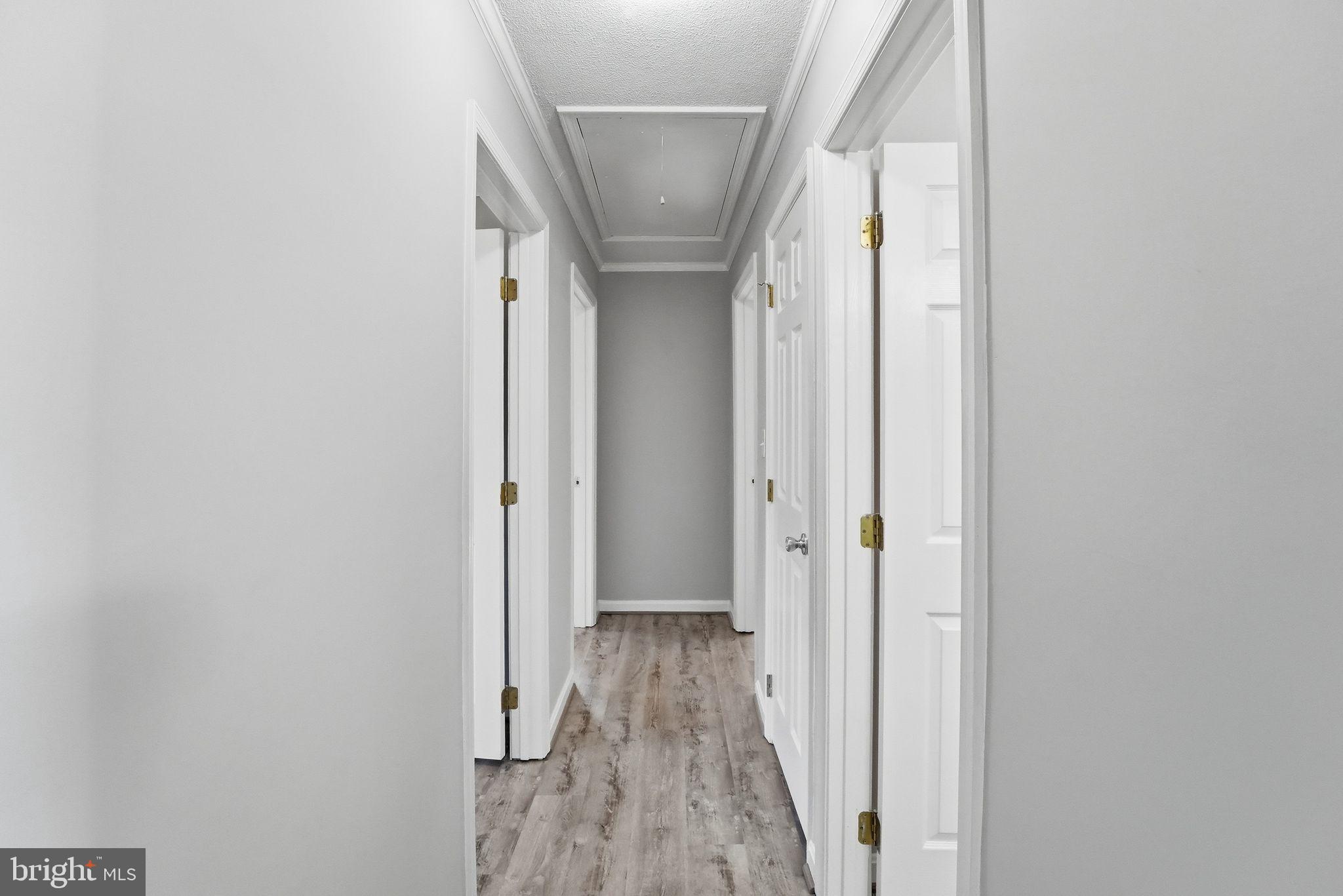 22064 Yellow Bottom Road Lignum, VA 22726 - Photo 19 of 50 a view of hallway with wooden floor and stairs