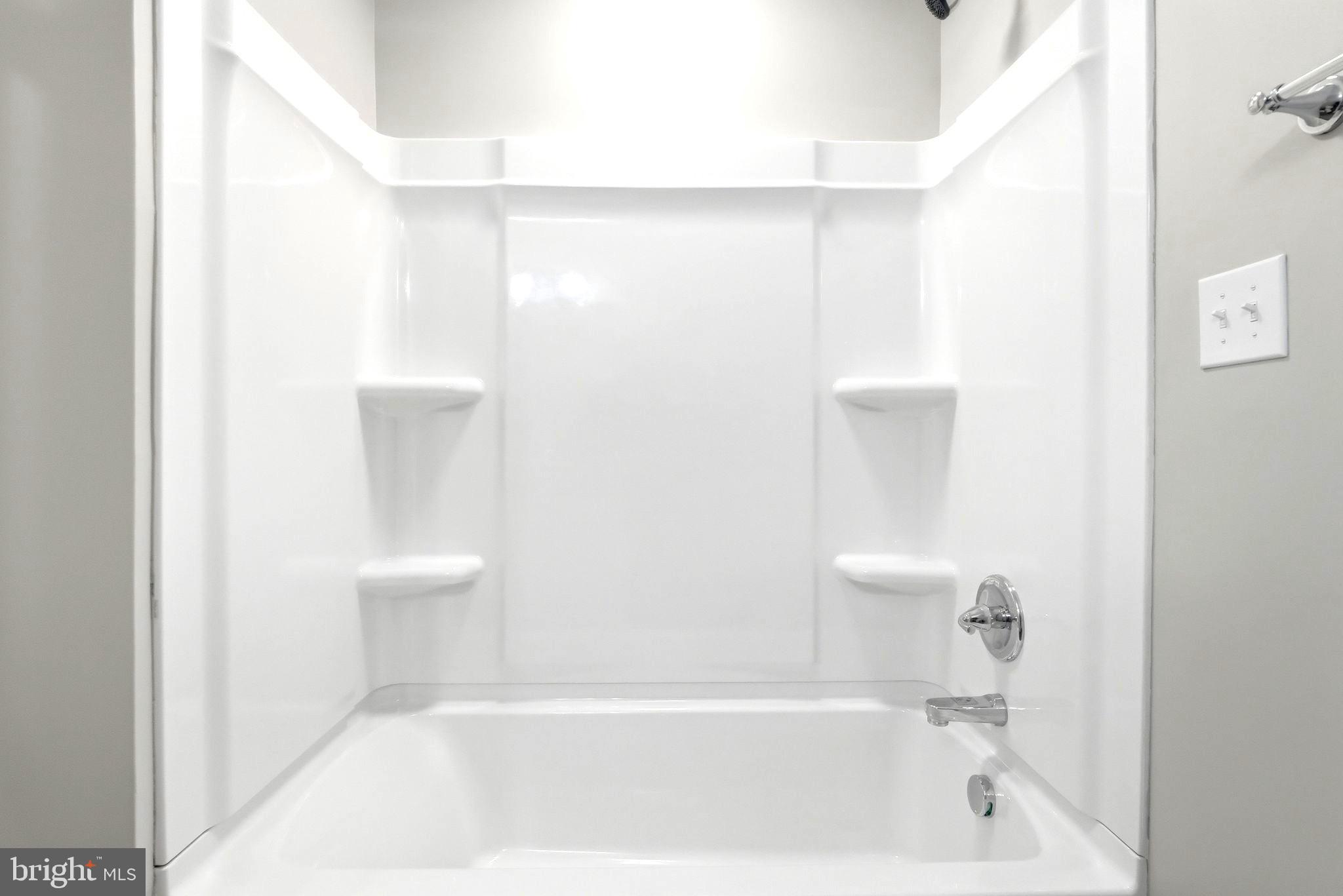 22064 Yellow Bottom Road Lignum, VA 22726 - Photo 21 of 50 a bathroom with a bathtub and a toilet