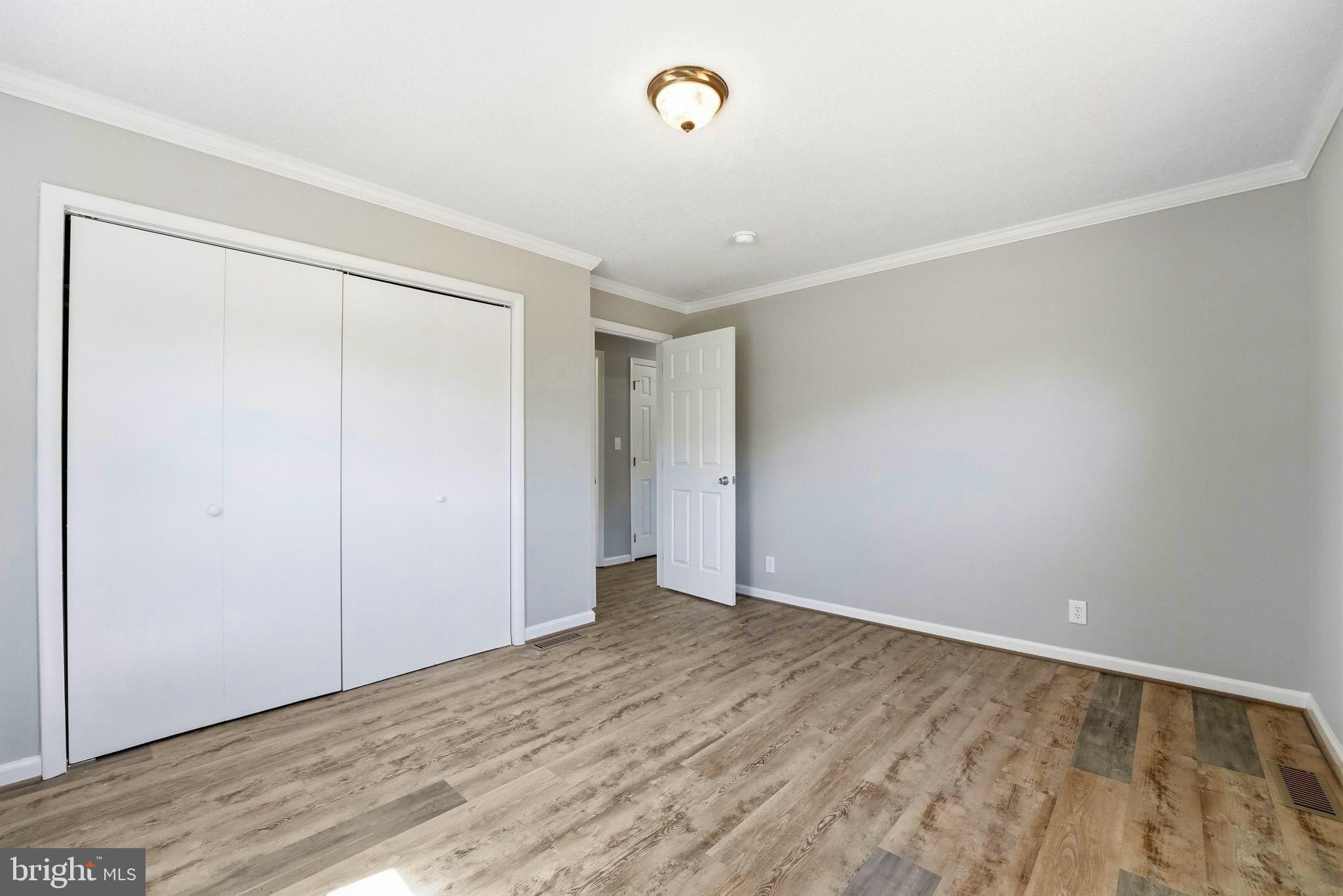 22064 Yellow Bottom Road Lignum, VA 22726 - Photo 25 of 50 a view of an empty room with wooden floor