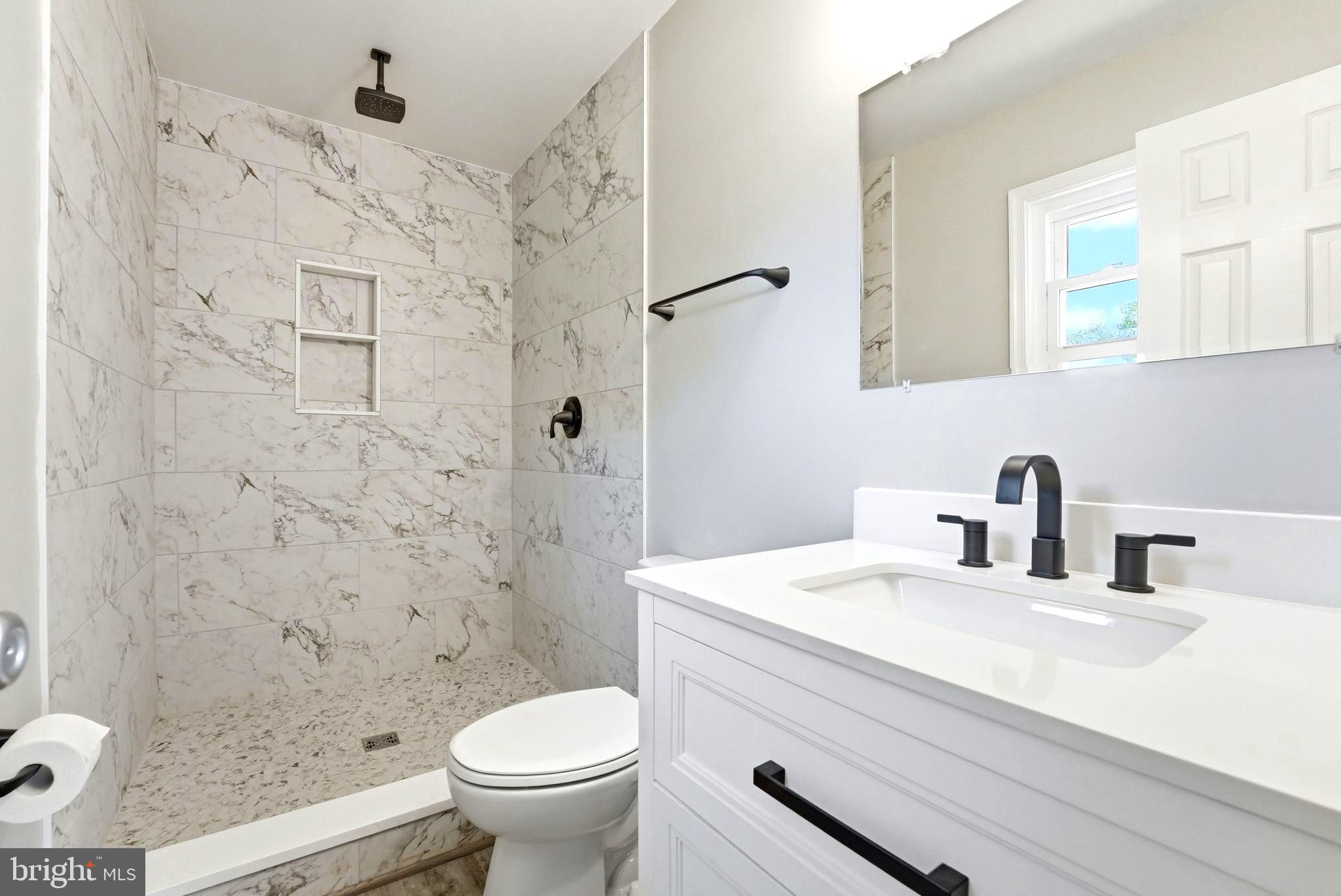 22064 Yellow Bottom Road Lignum, VA 22726 - Photo 27 of 50 a bathroom with a sink toilet and shower