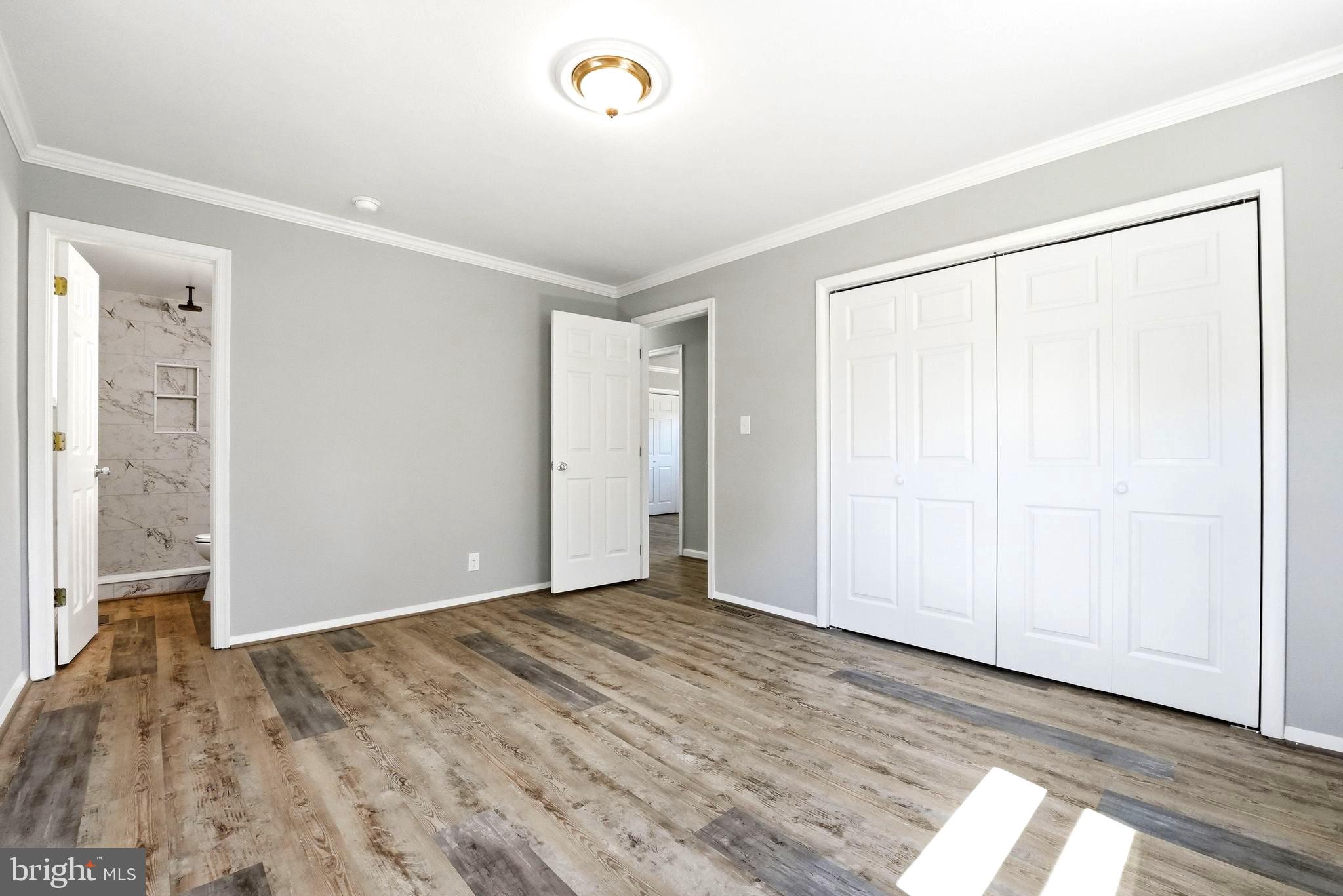 22064 Yellow Bottom Road Lignum, VA 22726 - Photo 29 of 50 an empty room with wooden floor and windows