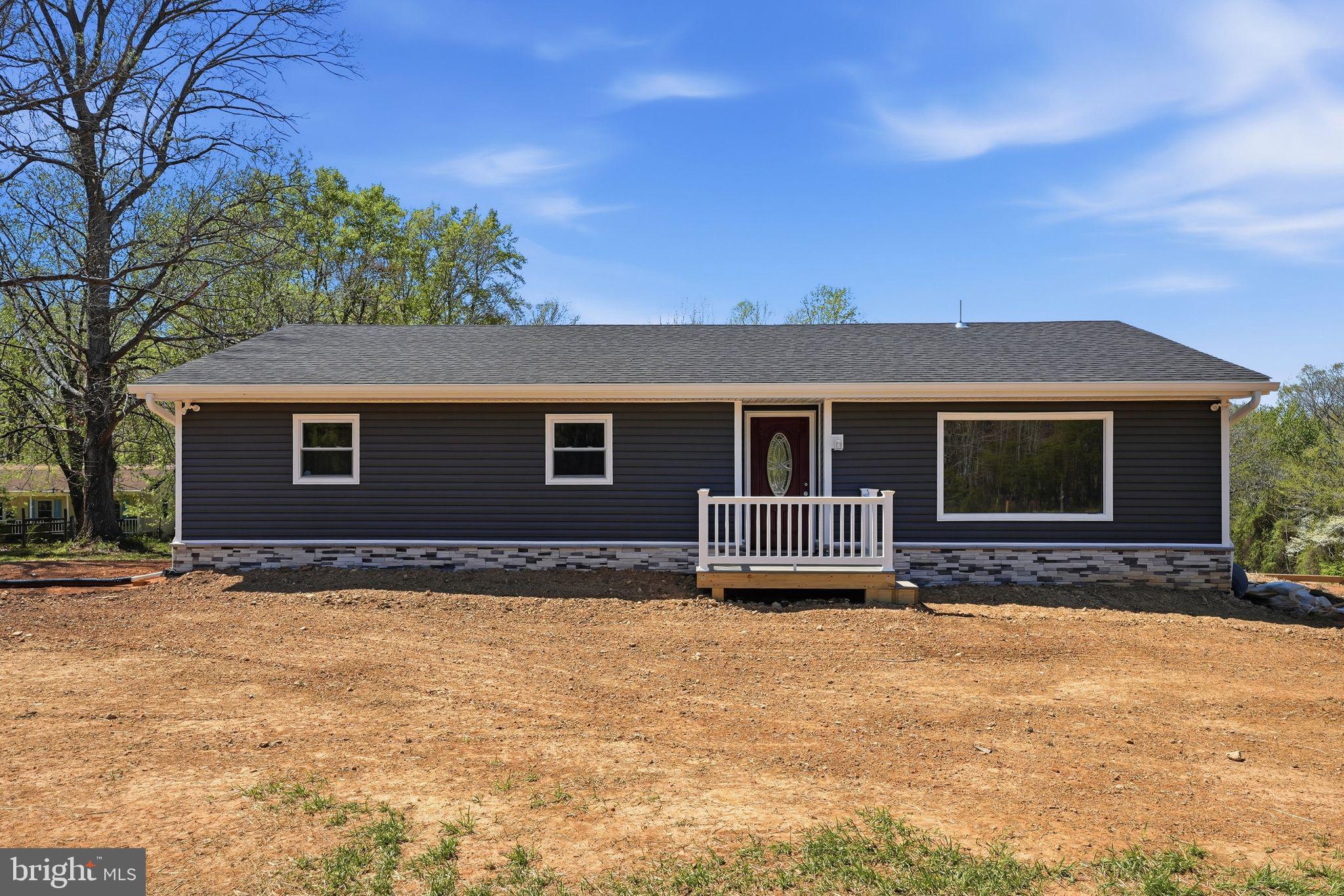 22064 Yellow Bottom Road Lignum, VA 22726 - Photo 3 of 50 a front view of a house with a yard