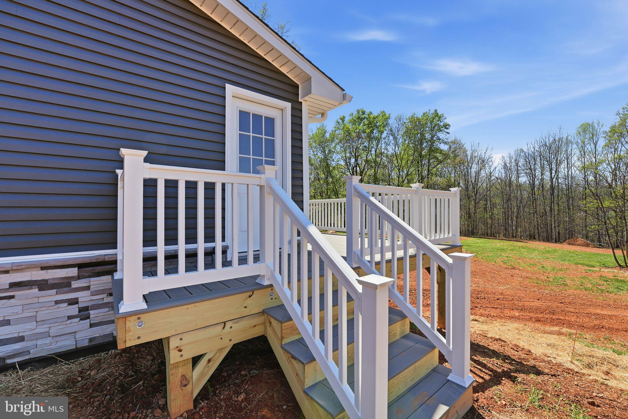 22064 Yellow Bottom Road Lignum, VA 22726 - Photo 32 of 50 a view of a house with backyard and deck