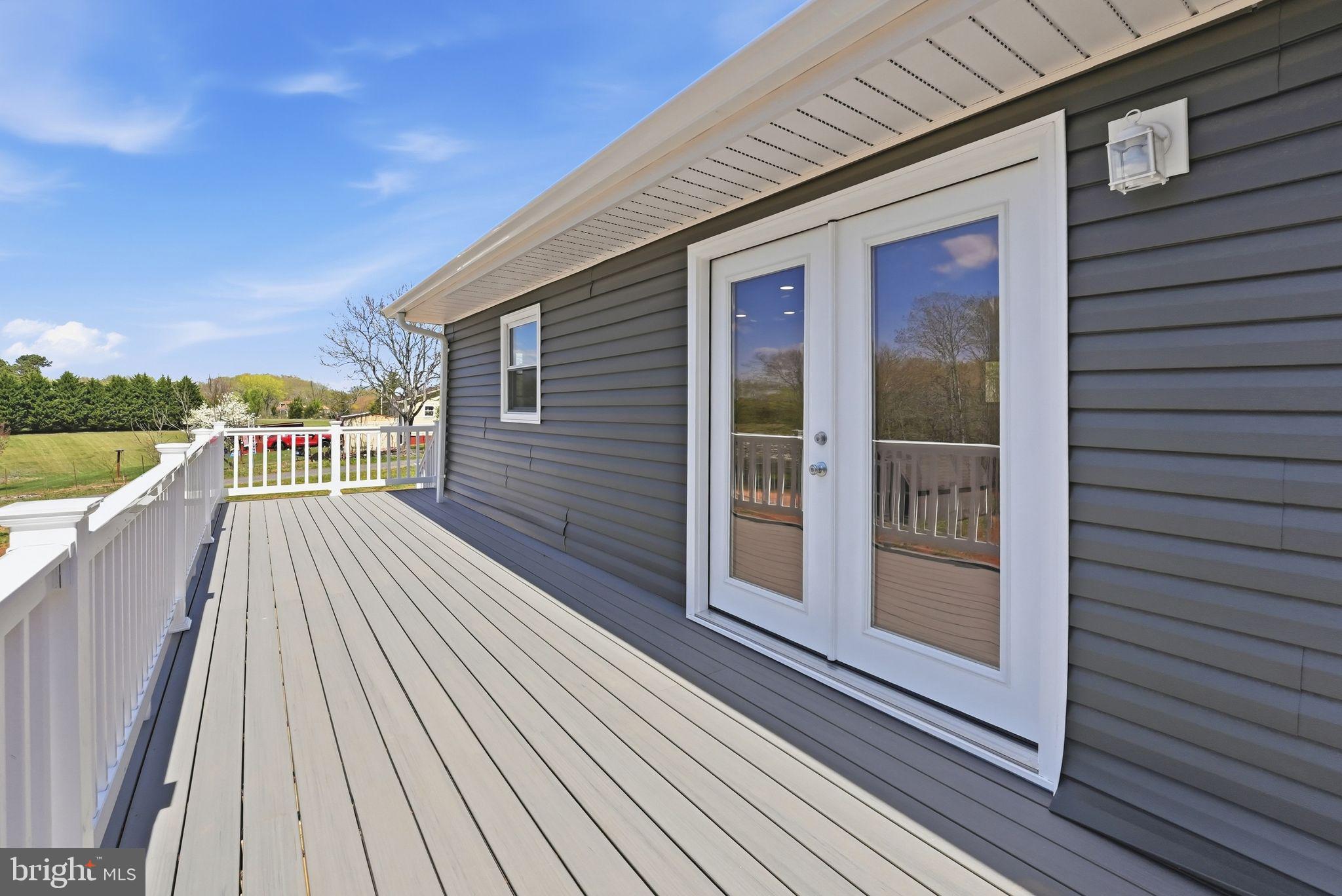 22064 Yellow Bottom Road Lignum, VA 22726 - Photo 38 of 50 a view of a balcony with wooden floor