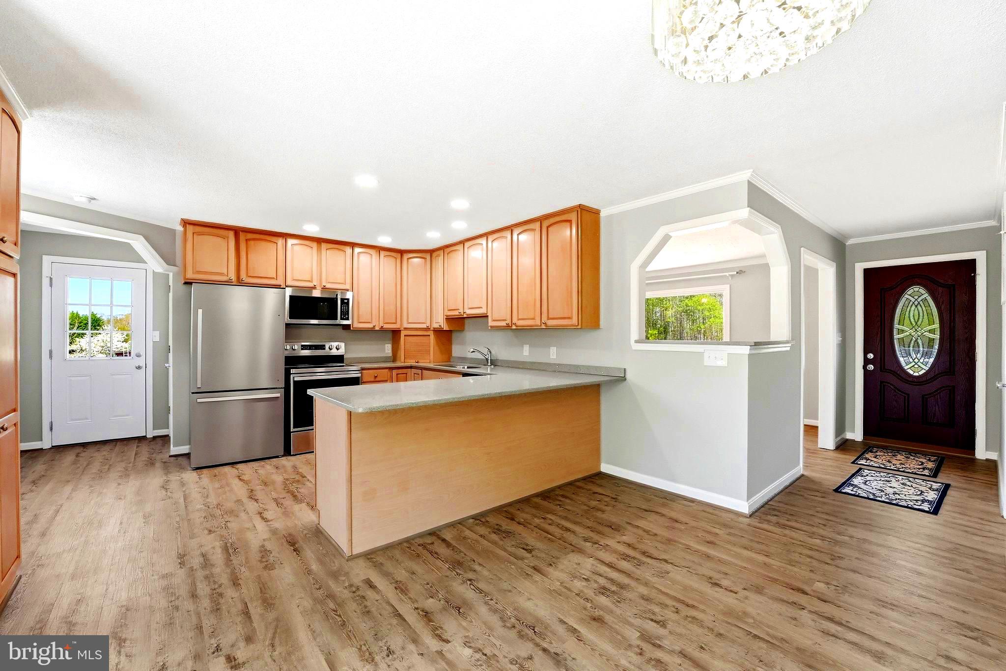 22064 Yellow Bottom Road Lignum, VA 22726 - Photo 6 of 50 a kitchen with stainless steel appliances a refrigerator and a stove top oven