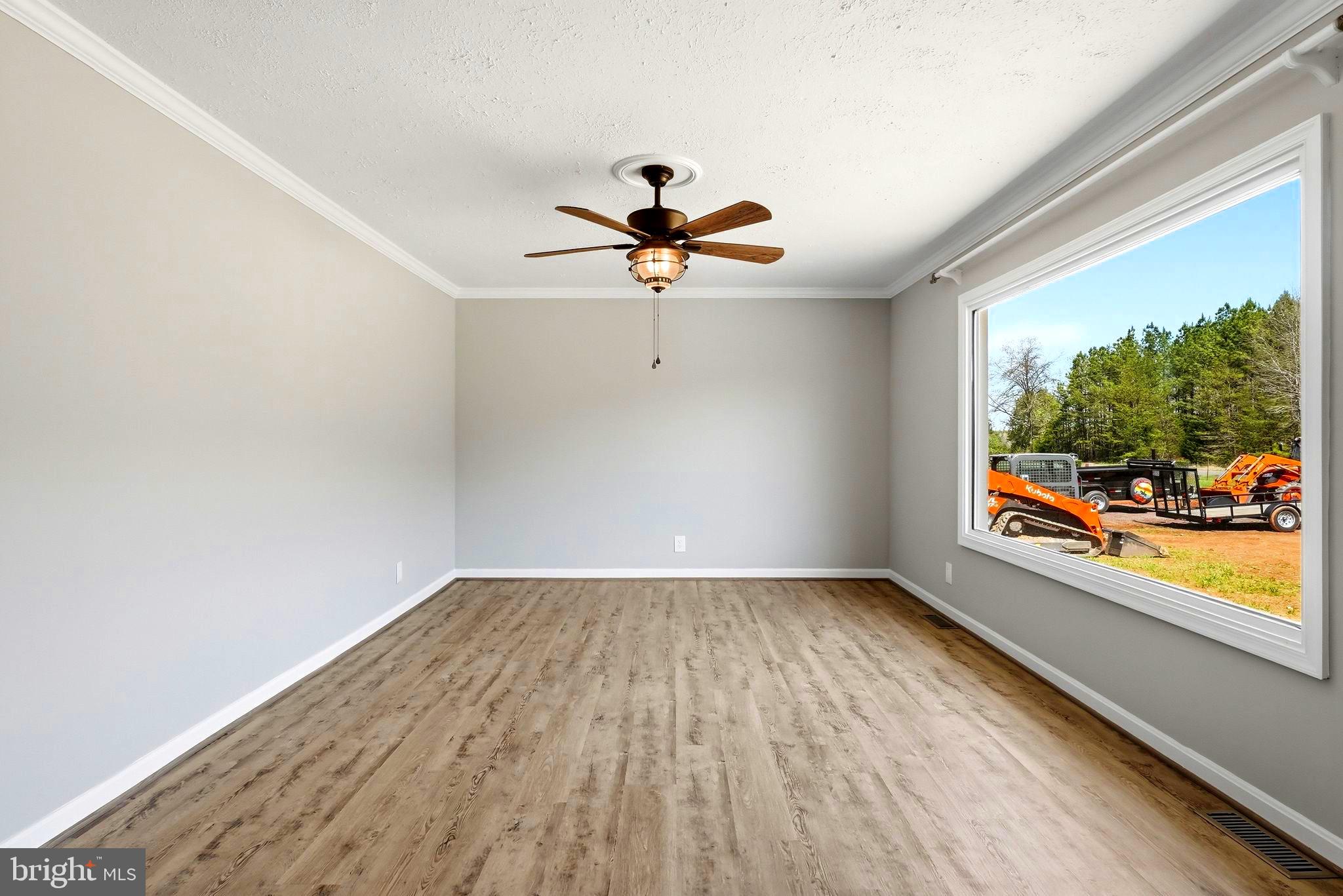 22064 Yellow Bottom Road Lignum, VA 22726 - Photo 8 of 50 wooden floor in an empty room with a window