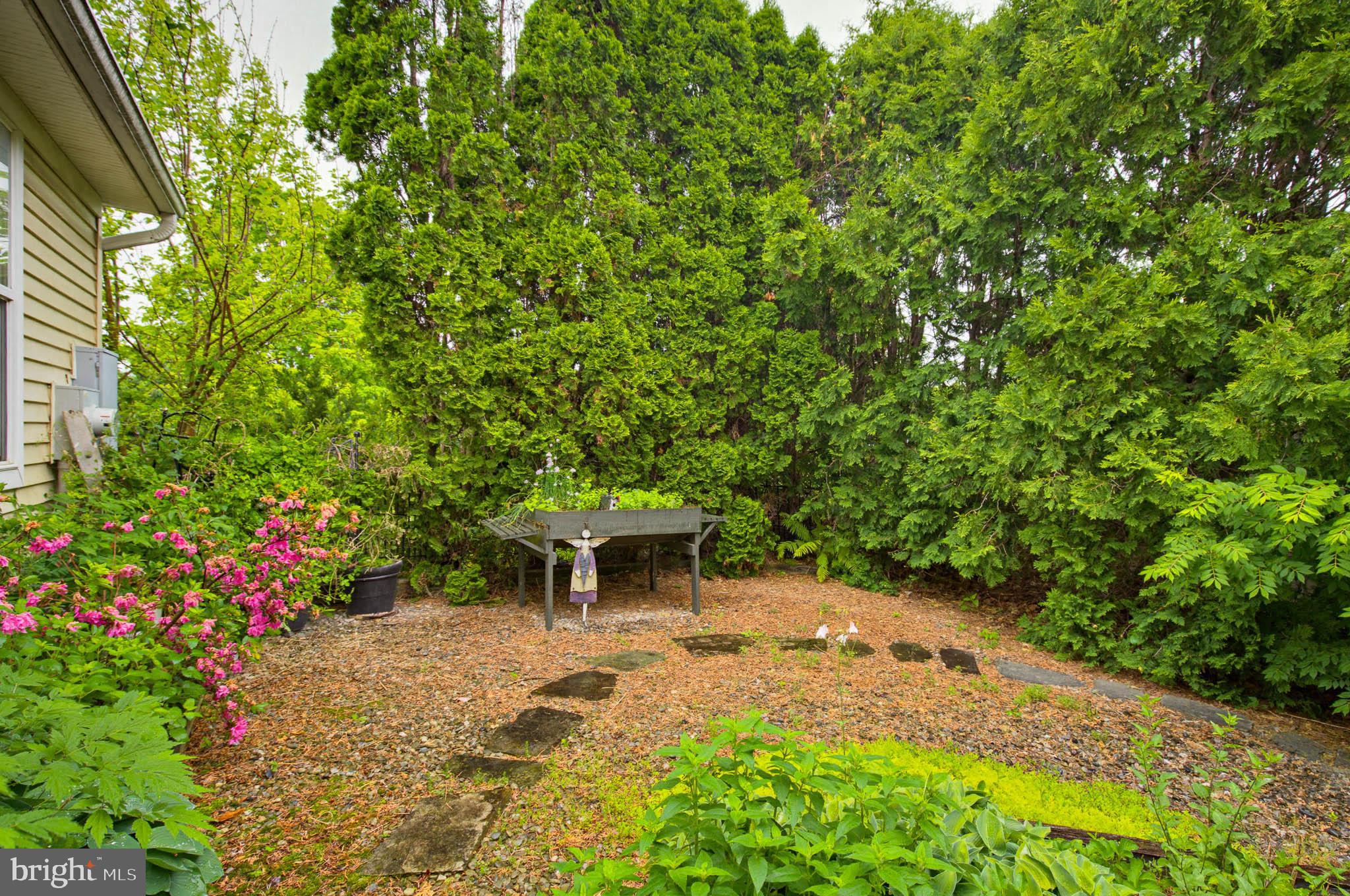 1037 Kent Garden Lititz, PA 17543 - Photo 10 of 31 a view of a backyard with table and chairs and potted plants