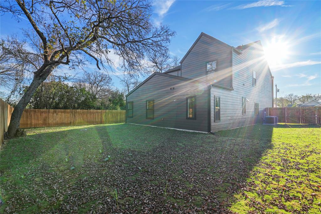 4712 Garrison Street Dallas, TX 75216 - Photo 28 of 30 View of side of property featuring a fenced backyard and a central air condition unit