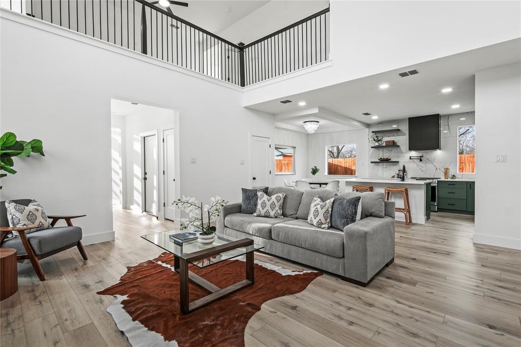 4712 Garrison Street Dallas, TX 75216 - Photo 7 of 30 Living area with light wood-style flooring, recessed lighting, ceiling fan, and a high ceiling