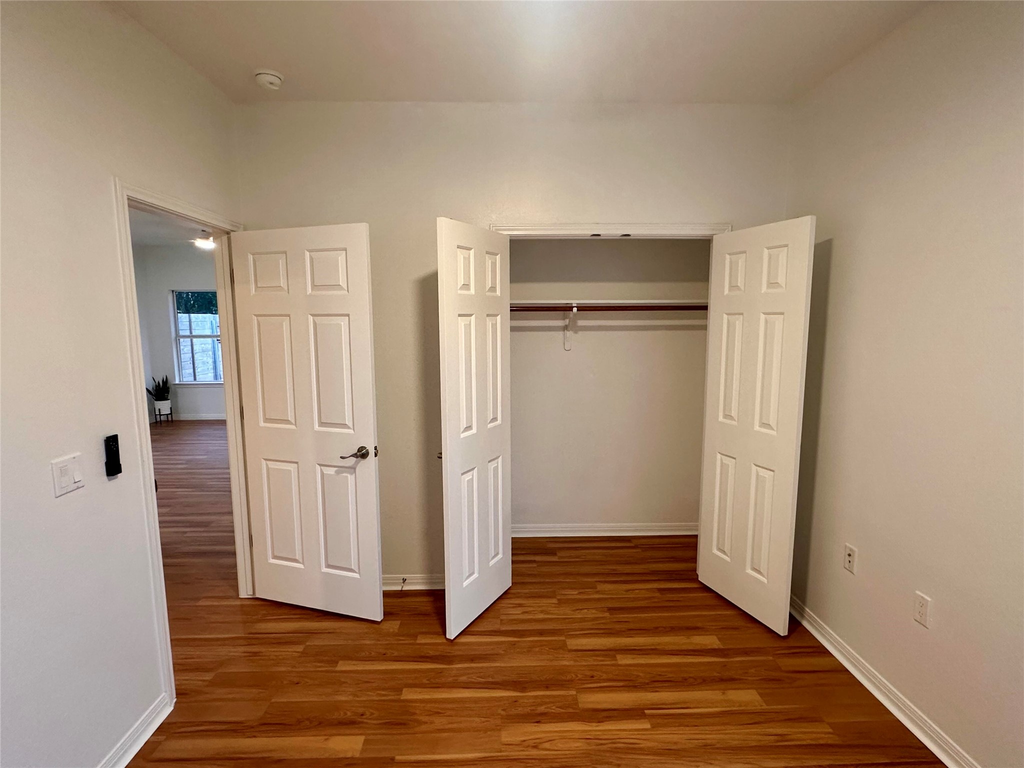 1122 Mansell Avenue Austin, TX 78721 - Photo 25 of 29 a view of an empty room with wooden floor and closet area