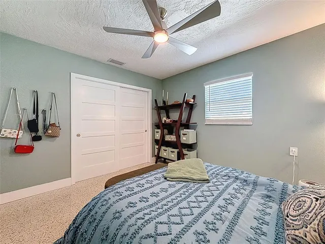 a bedroom with a bed and a closet