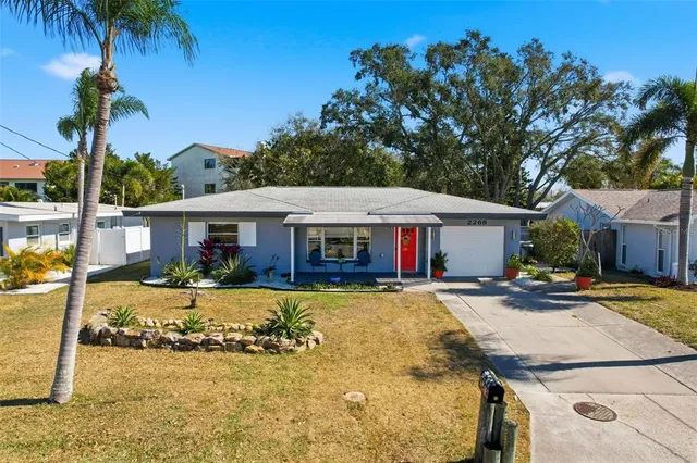 a front view of house with yard slide and outdoor seating
