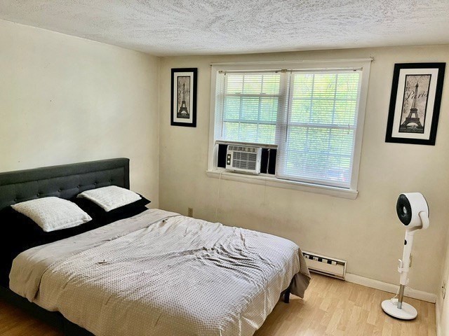 41 Leonard Road, Unit 41 Boxborough, MA 01719 - Photo 5 of 7 a bedroom with a bed and window
