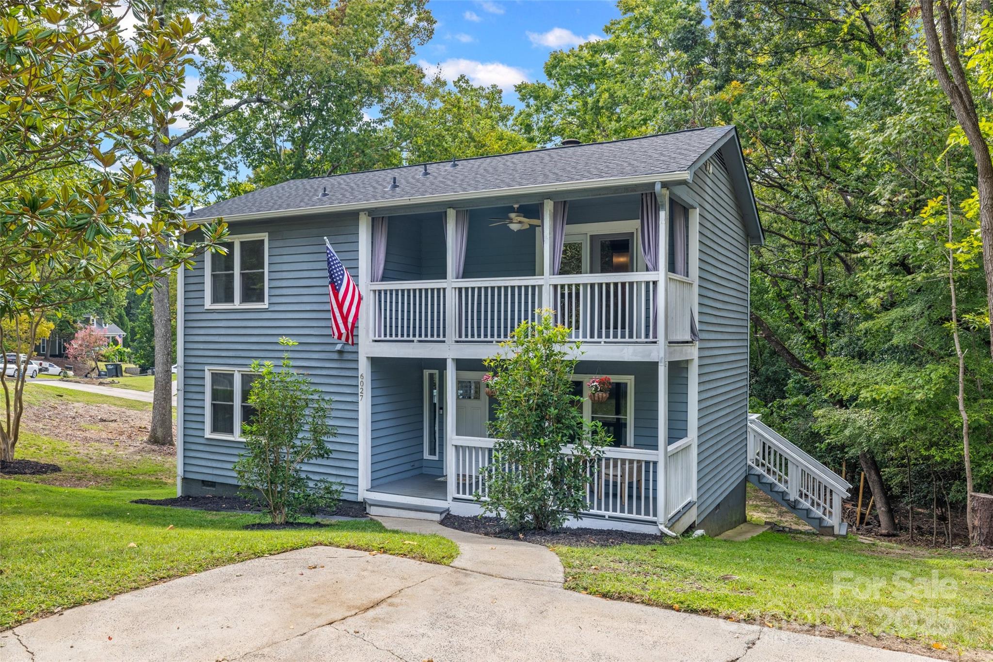 a view of front of house with a yard