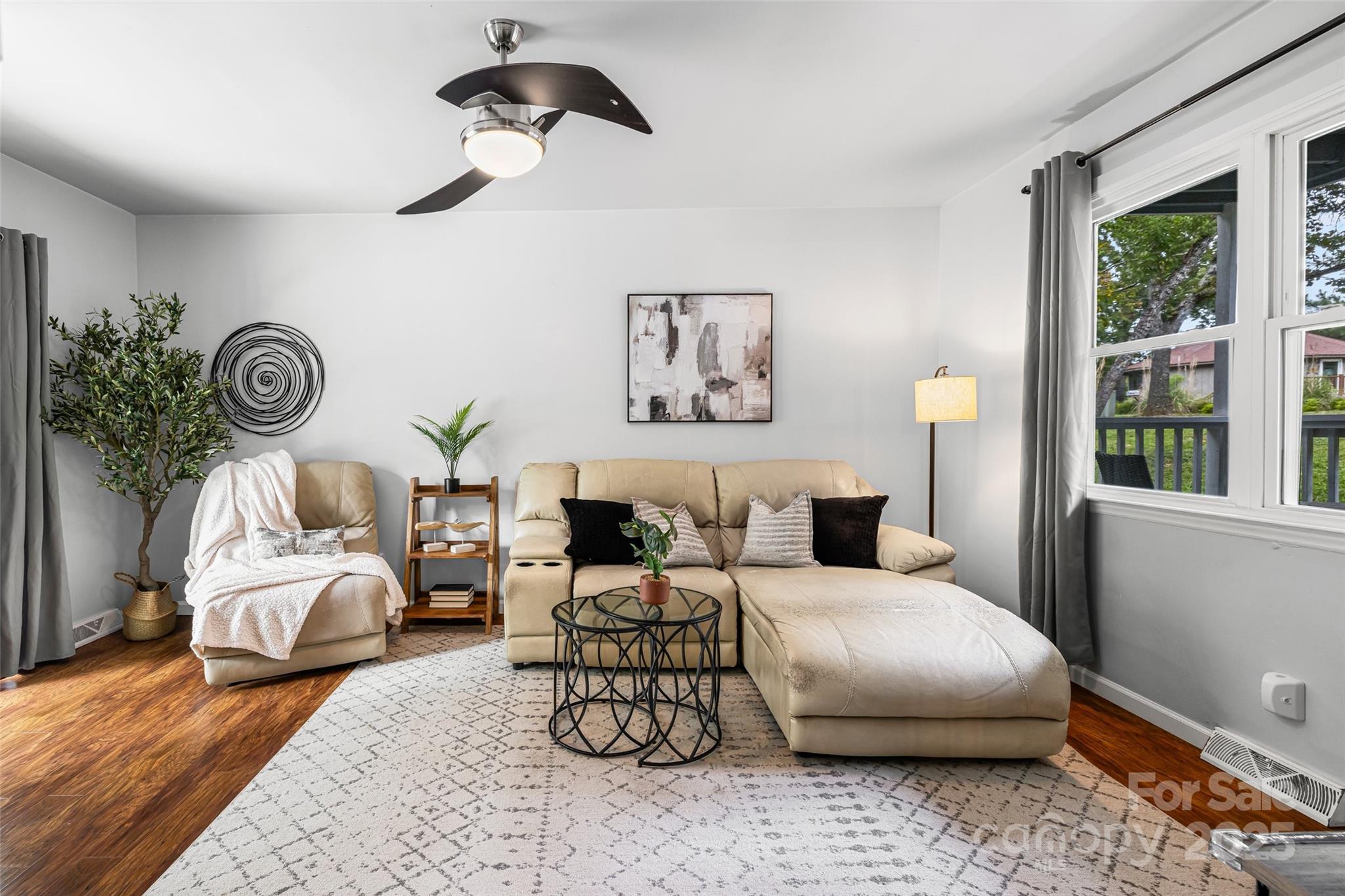 6027 Windjammer Drive Tega Cay, SC 29708 - Photo 12 of 34 a living room with furniture and windows