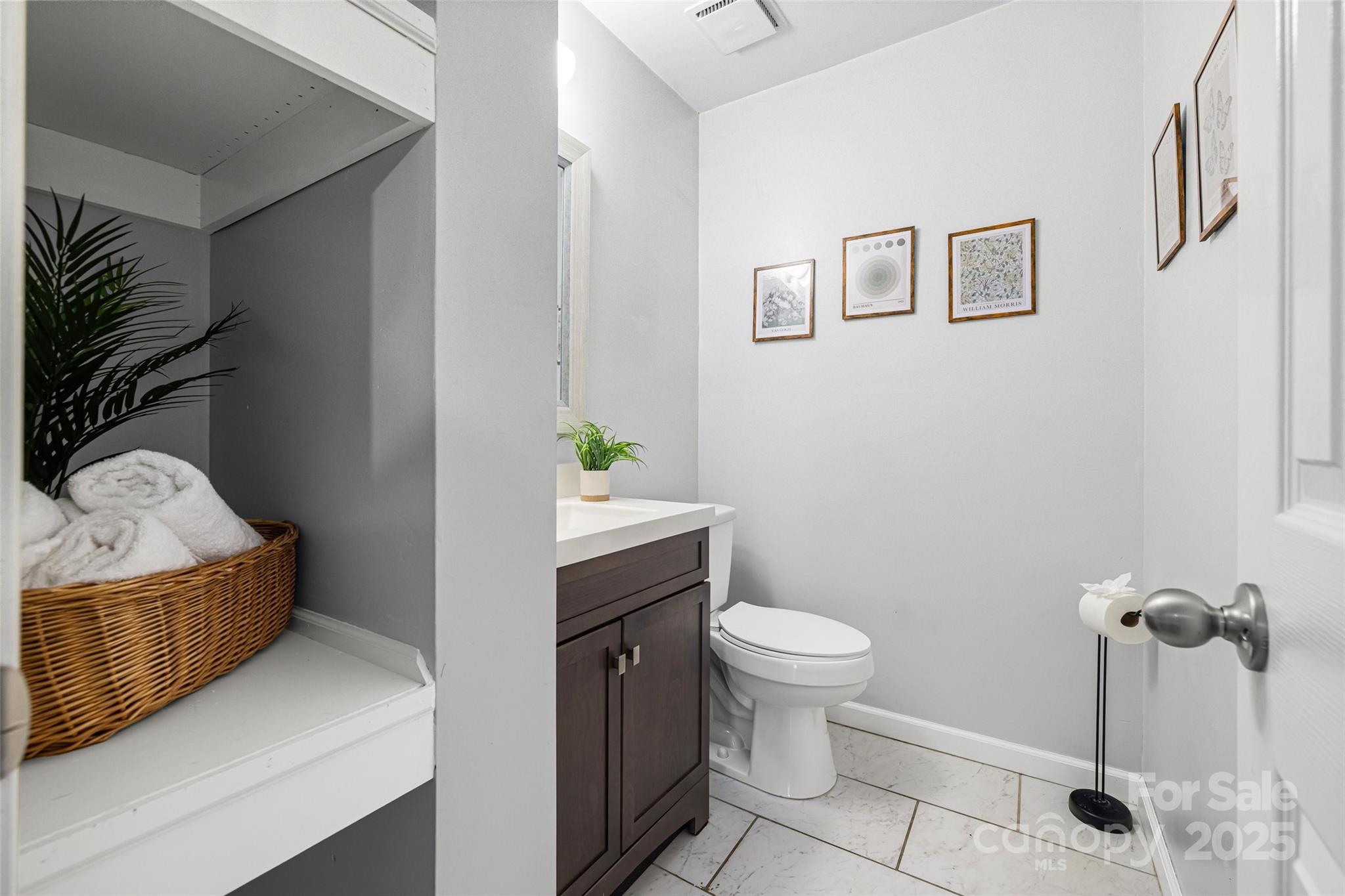 6027 Windjammer Drive Tega Cay, SC 29708 - Photo 16 of 34 a bathroom with a sink toilet and shower