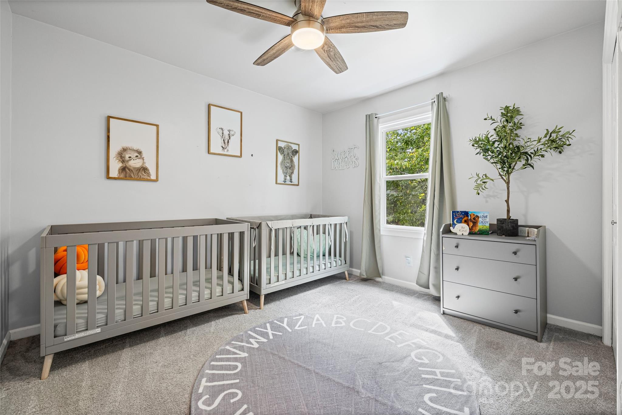 6027 Windjammer Drive Tega Cay, SC 29708 - Photo 23 of 34 a bedroom with furniture and a window