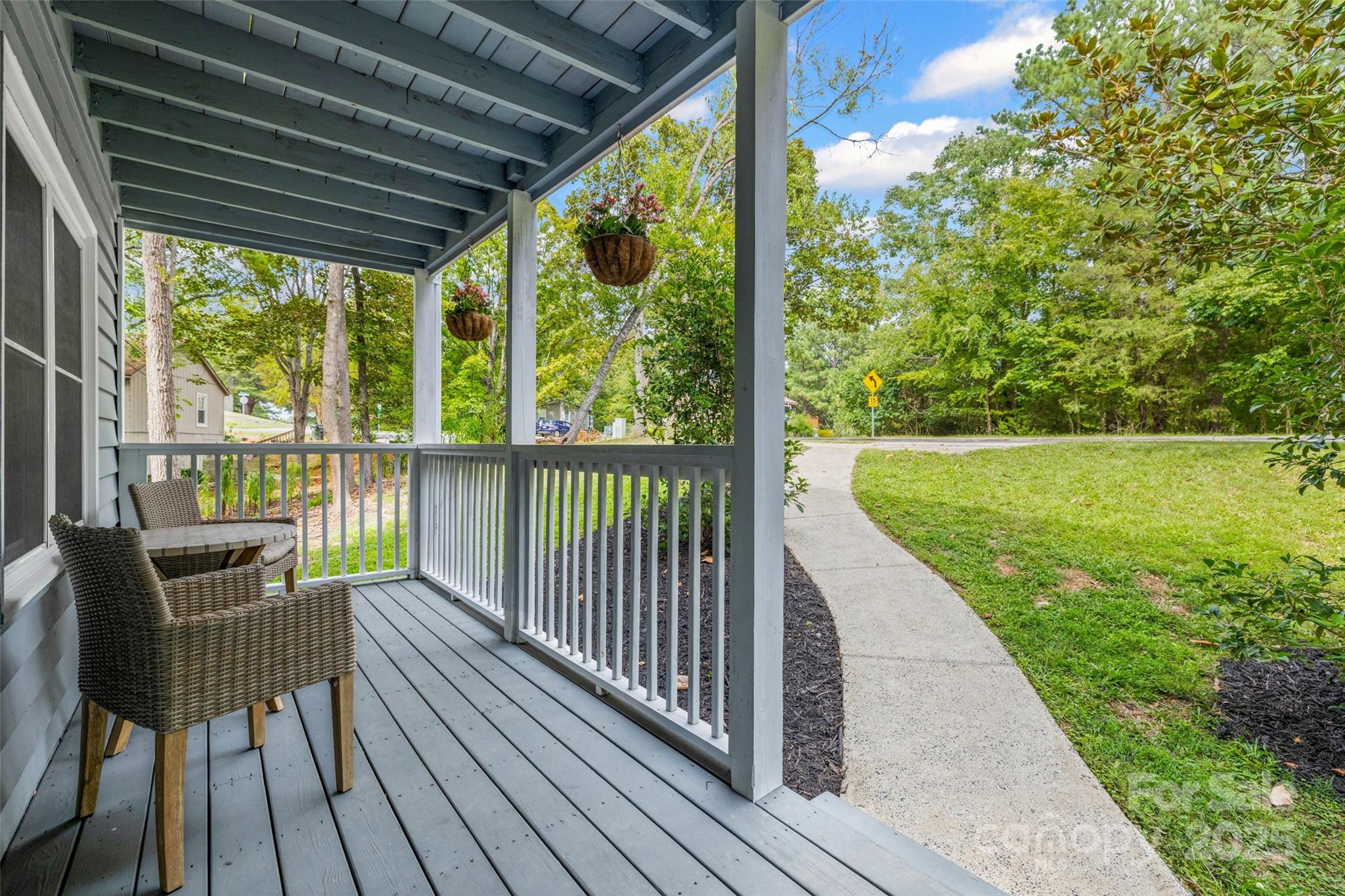6027 Windjammer Drive Tega Cay, SC 29708 - Photo 26 of 34 a view of a chair and table on the deck