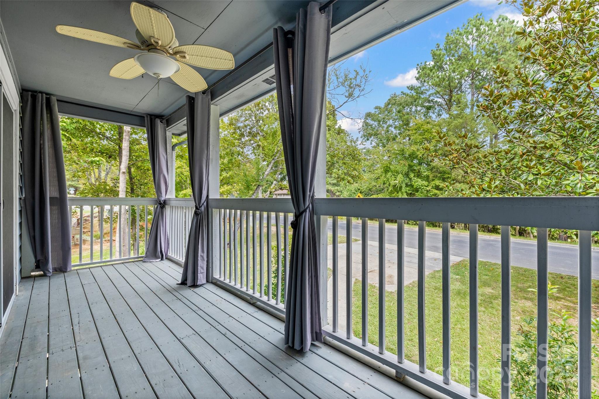 6027 Windjammer Drive Tega Cay, SC 29708 - Photo 27 of 34 a view of a room with wooden floor and balcony