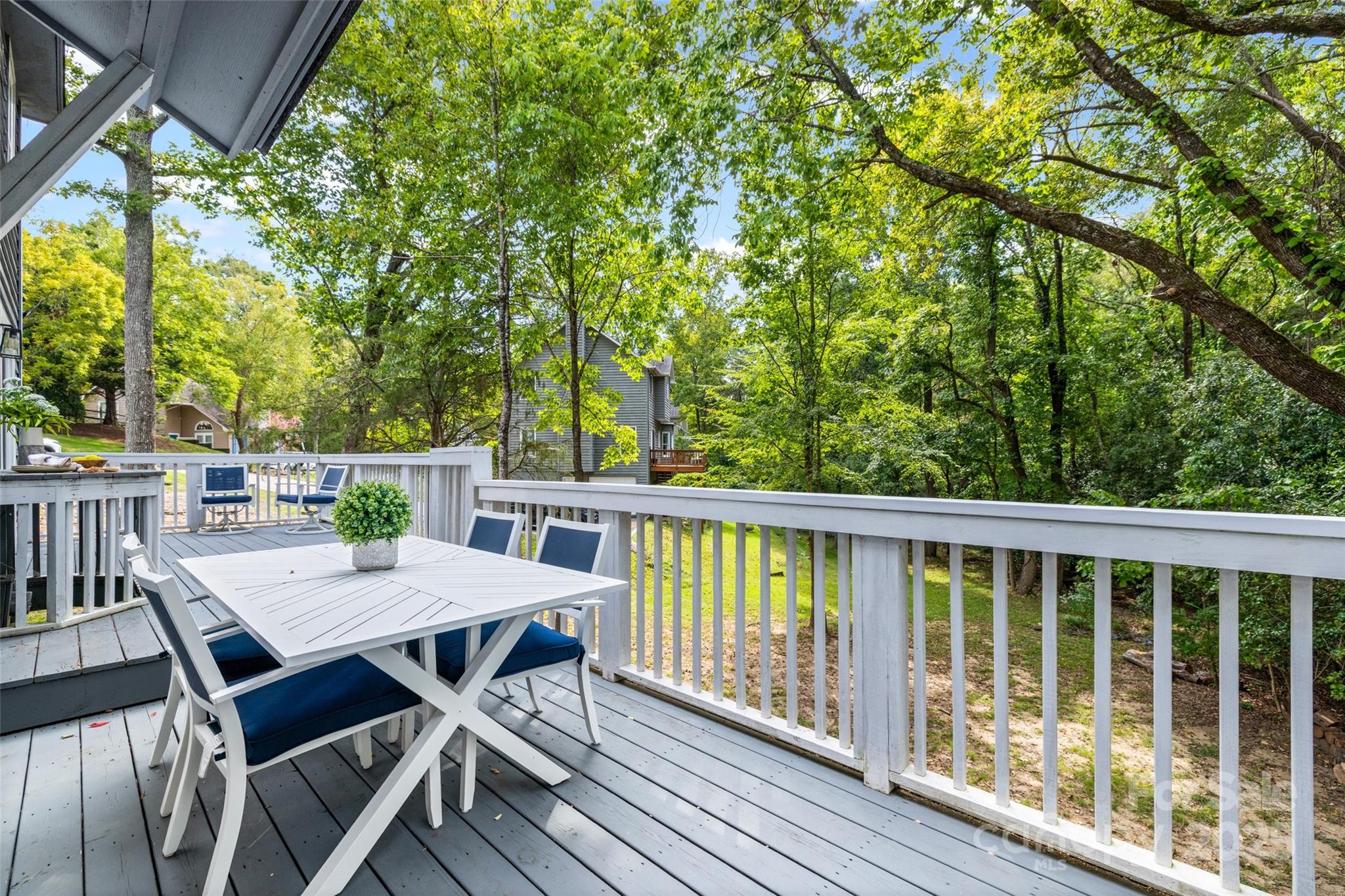 6027 Windjammer Drive Tega Cay, SC 29708 - Photo 29 of 34 a view of a balcony with table and chairs