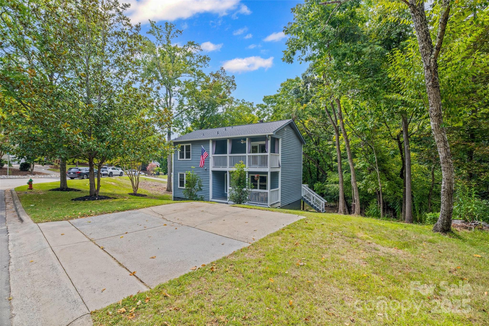 6027 Windjammer Drive Tega Cay, SC 29708 - Photo 30 of 34 a view of a house with a yard