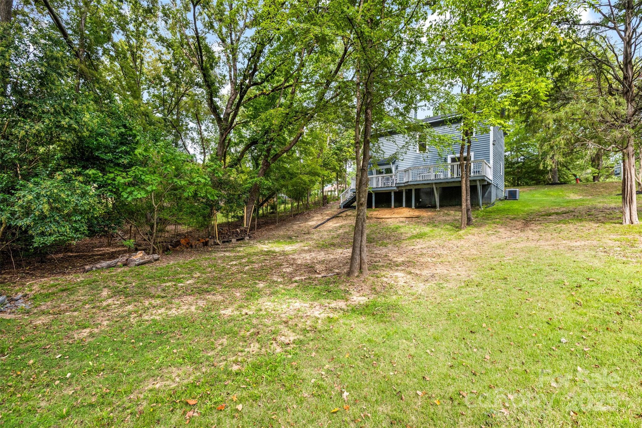 6027 Windjammer Drive Tega Cay, SC 29708 - Photo 31 of 34 a view of a house with a yard