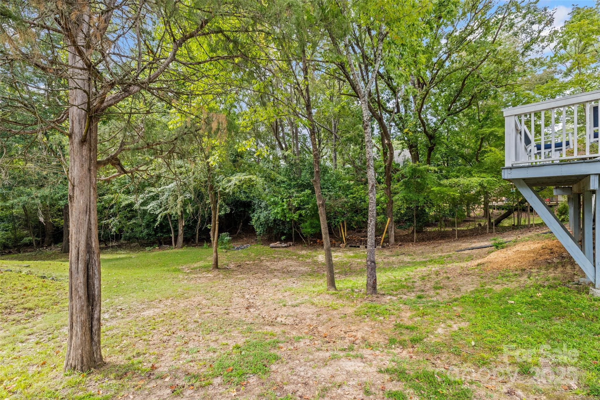 6027 Windjammer Drive Tega Cay, SC 29708 - Photo 32 of 34 a view of outdoor space with deck and backyard