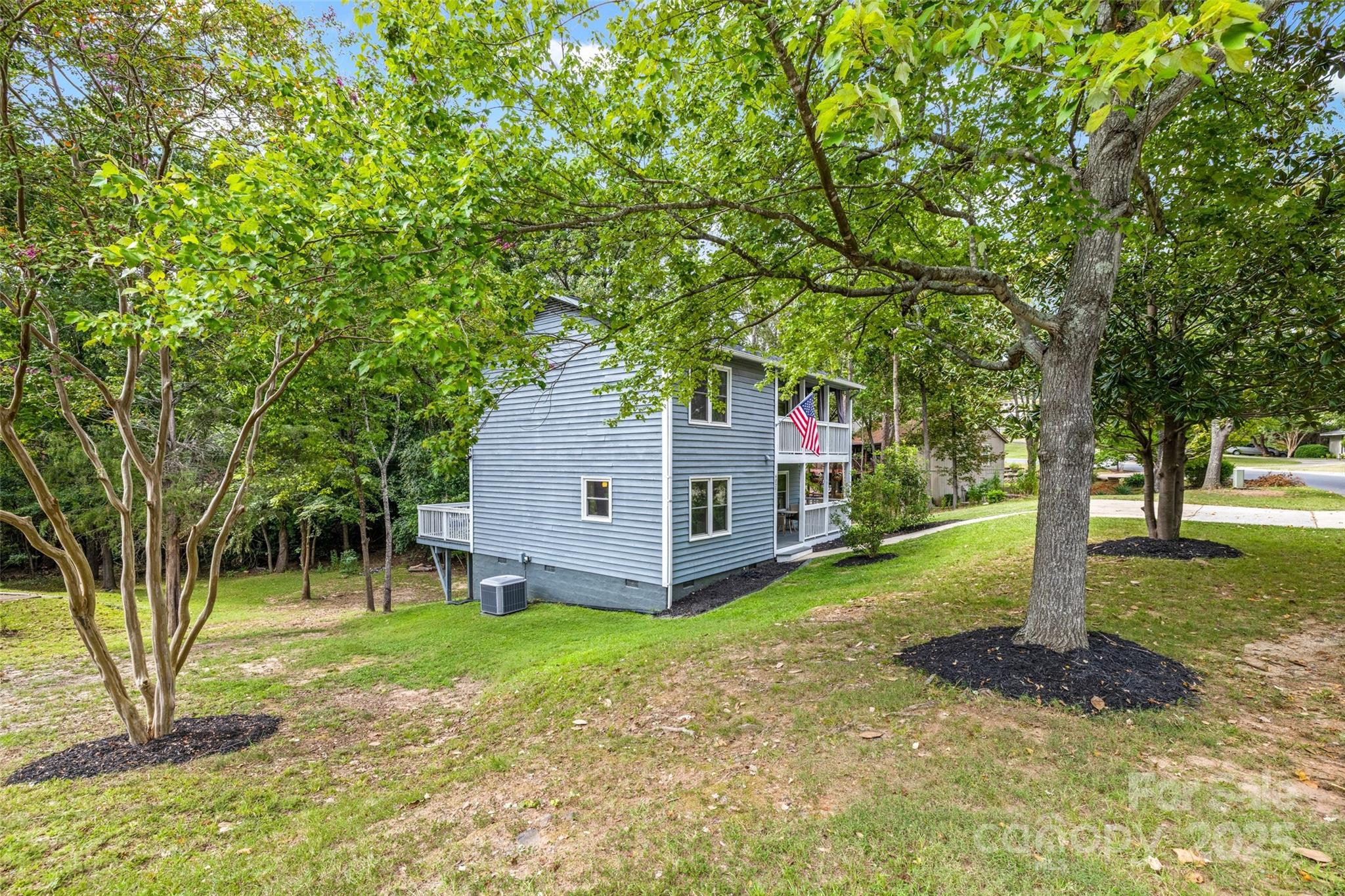6027 Windjammer Drive Tega Cay, SC 29708 - Photo 34 of 34 a view of a house with a yard