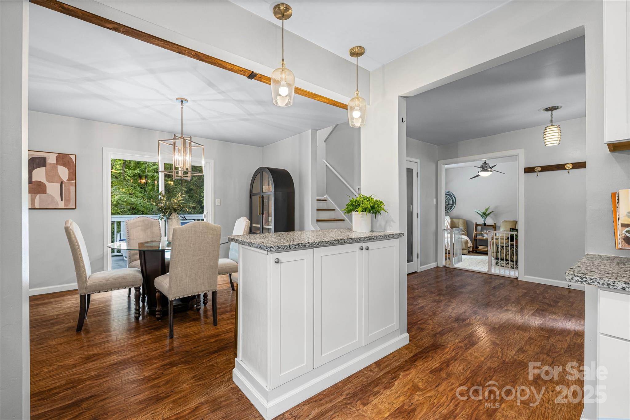 6027 Windjammer Drive Tega Cay, SC 29708 - Photo 8 of 34 a view of a dining room with furniture window and wooden floor
