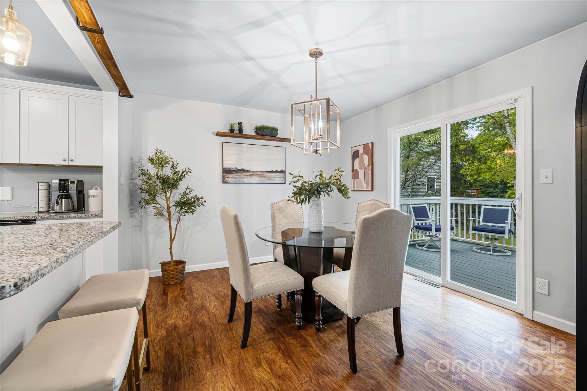 6027 Windjammer Drive Tega Cay, SC 29708 - Photo 10 of 34 a view of a dining room with furniture window and wooden floor