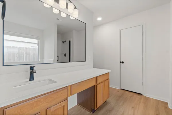 a bathroom with a sink and a mirror