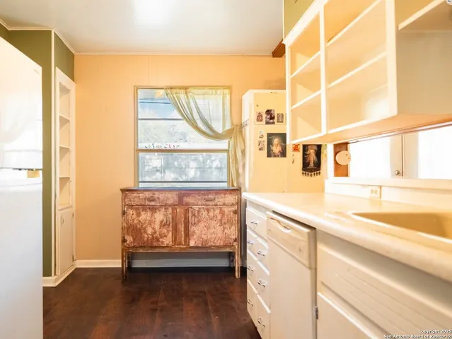 a view of a living room with a large window