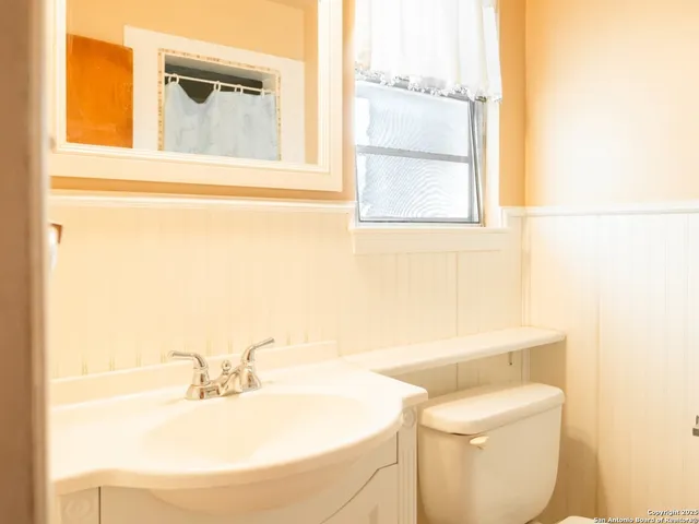 a bathroom with a sink and a toilet