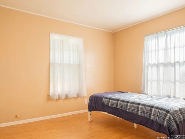 a bedroom with a bed and window